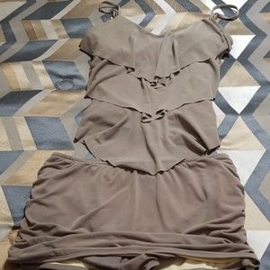 A 2 piece swim suit with skirt and pleated top